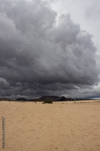 Sand dunes and cloudy sky, Fuerteventura, Spain