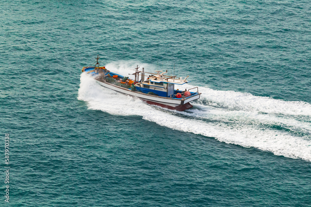 Fototapeta premium Fast fisher boat is on the way