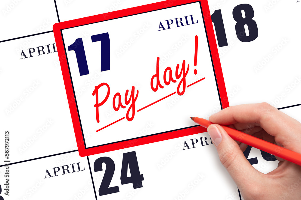 Hand writing text PAY DATE on calendar date April 17 and underline it. Payment due date Hand writing text PAY DATE on calendar date April 17 and underline it. Payment due date