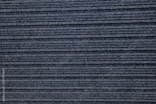 Textured black granite slab with dark stripes