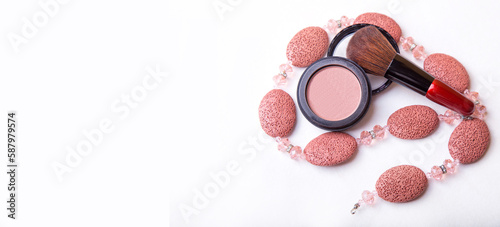 Pink blush powder and blush brush. Top view, copy space. Makeup concept. banner