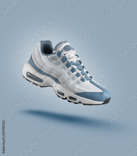 White sneaker with light blue accents on blue gradient background, men's fashion, sport shoe, air, sneakers, lifestyle, concept, product photo, levitation concept, street wear, trainers