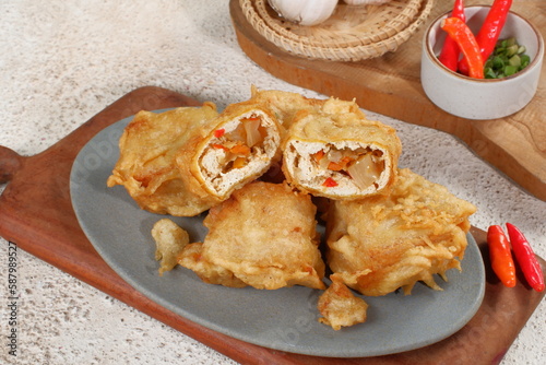 tahu pedas or Fried Tofu with chili and vegetables,  Traditional Popular Snack from Indonesia photo