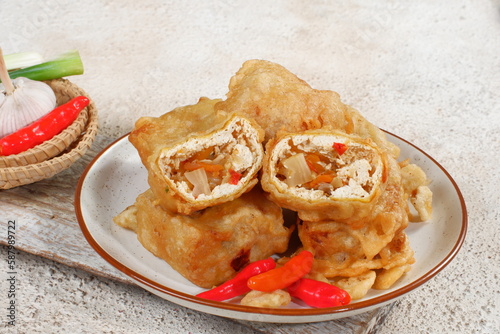 tahu pedas or Fried Tofu with chili and vegetables,  Traditional Popular Snack from Indonesia