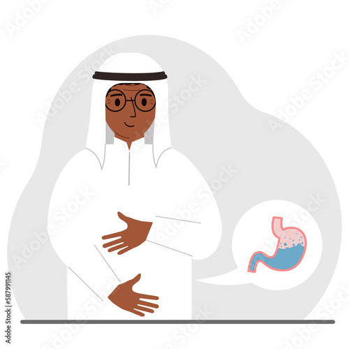 The concept of a healthy stomach. The arab man holds her stomach with both hands. A healthy stomach or proper digestion.