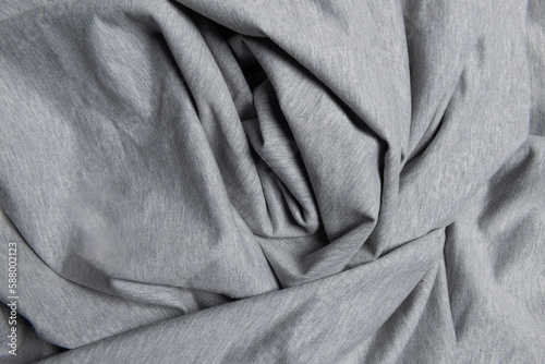 High resolution top view grey knitted cotton fabric with creases