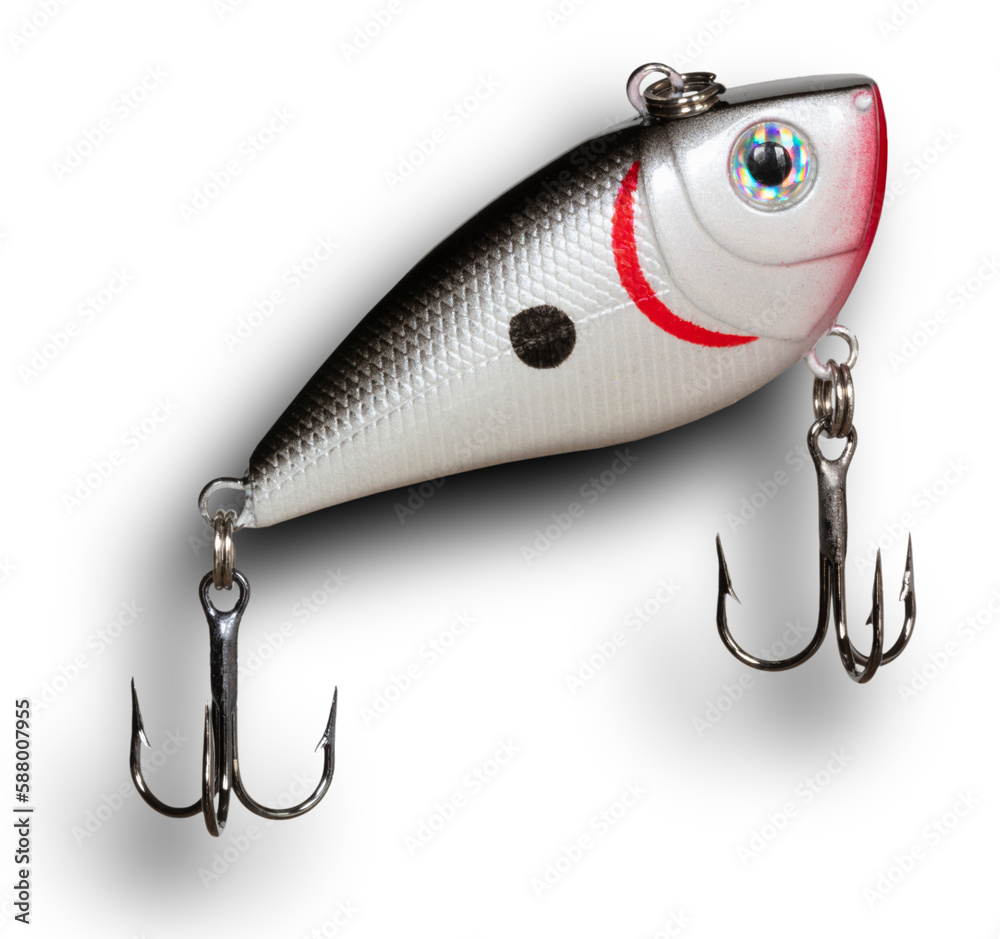 Shadow behind a grey, red and white plastic fishing lure angling toward the surface
