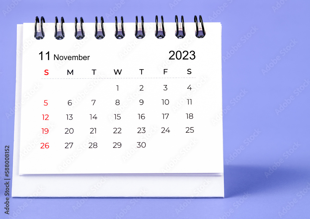 The November 2023 Monthly desk calendar for 2023 year on purple background. The November 2023 Monthly desk calendar for 2023 year on purple background.