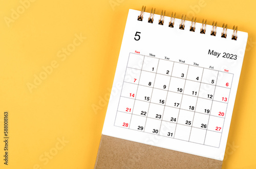 A May 2023 Monthly desk calendar for 2023 year on yellow background.