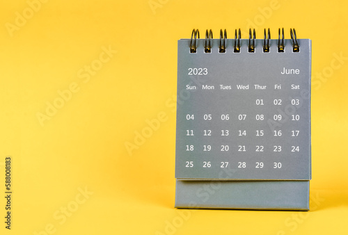 The June 2023 desk calendar for 2023 year on yellow color background.