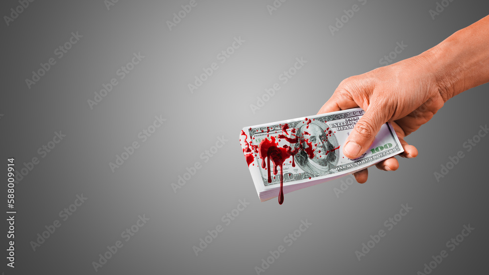 Hand giving bloody money. Splash blood on $100 Banknote. Money stained with blood. - obrazy, fototapety, plakaty 