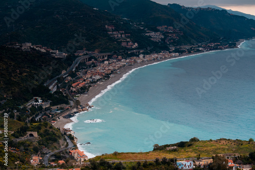 Summer in Taormina, Sicily. Panoramic view from above. Where the sea meets the city