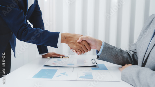 Shaking hands, Young Asia female leader business woman coaching new smes bookkeeping audit accounting interview with trainer training business job.