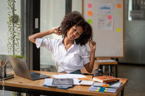 Black woman stretching due to pain from work, tried from work, stretch oneself.