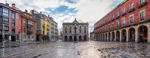 Great panoramic view of the main square of the city of Gijon with its classic buildings and stone arches, Asturias, Spain. photo