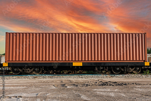 Train wagons carrying cargo containers for shipping companies.