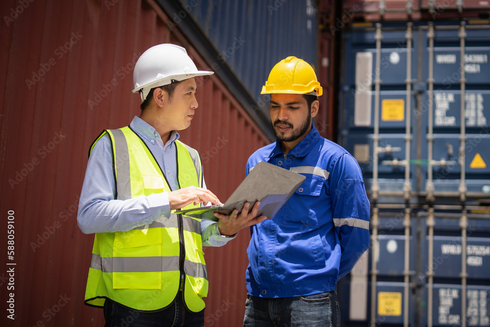 Engineer manager and foreman using laptop computer control or check inventory details of containers box, worker checking quantity of product in containers. Engineer manager and foreman using laptop computer control or check inventory details of containers box, worker checking quantity of product in containers.