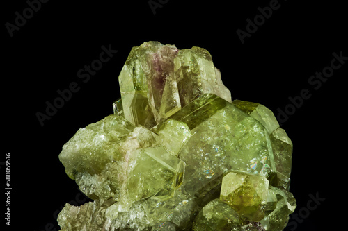green vesuvianite (also known as idocrase) crystal. macro detail texture background. close-up raw rough unpolished semi-precious gemstone photo