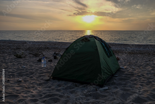 tent for camping on the beach on the background of the Seascape