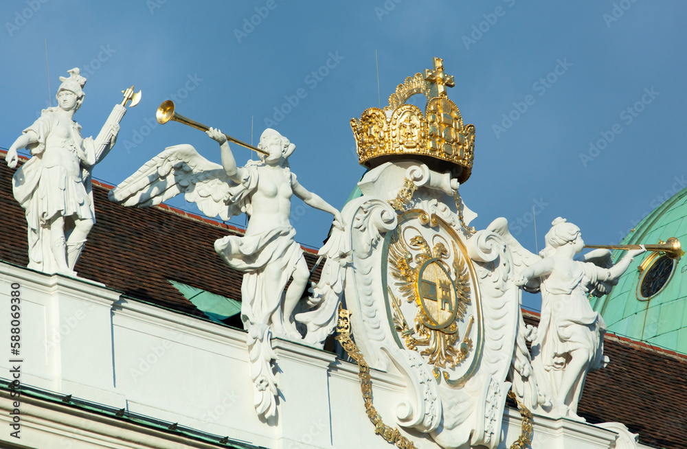 Obraz premium Vienna's Historic Building Exterior With A Coat Of Arms