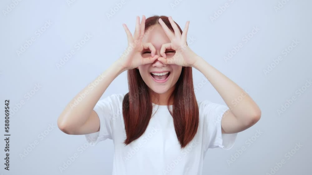 Asian girl showing ok sign, good feedback Asian girl showing ok sign, good feedback