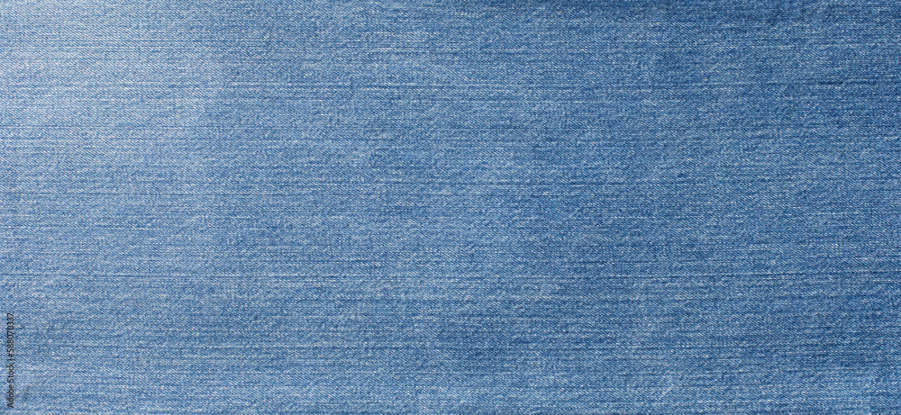 Blue denim jeans texture banner with copy space for text design background. Canvas denim fashion texture. Panoramic fashion banner Blue denim jeans texture banner with copy space for text design background. Canvas denim fashion texture. Panoramic fashion banner
