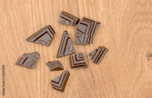 Pieces of chocolate isolated on a white background . Top view. Flat lay