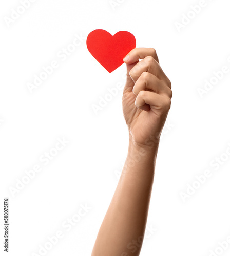 charity, love and health concept - close up of hand holding red paper heart over white background