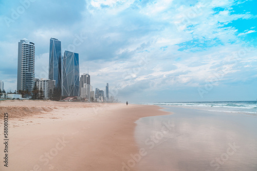 Spectacular panorama of the Gold Coast skyline and Surfers Paradise beach with rolling waves of Pacific ocean on a beautiful cloudy day.   © SeaRain