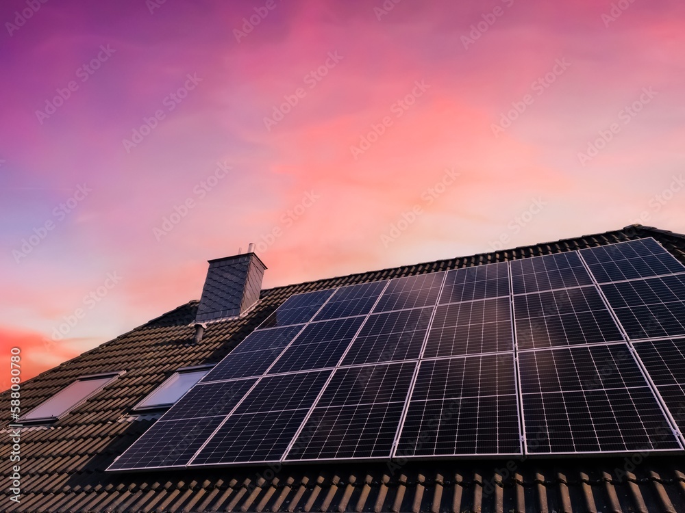 Solar panels producing clean energy on a roof of a residential house