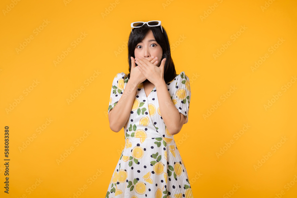 Portrait asian young woman hushing with hand sign shares secret makes taboo gesture wears casual springtime dress isolated on yellow background. Shh be quiet concept Portrait asian young woman hushing with hand sign shares secret makes taboo gesture wears casual springtime dress isolated on yellow background. Shh be quiet concept