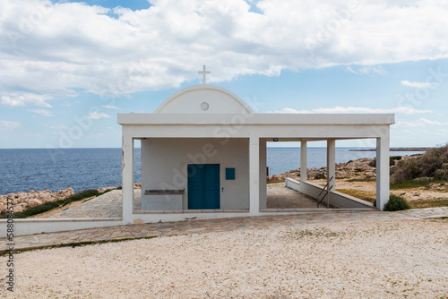 Greek Ayioi Anargiroi Church in Cyprus. A small Orthodox church on an island by the sea photo