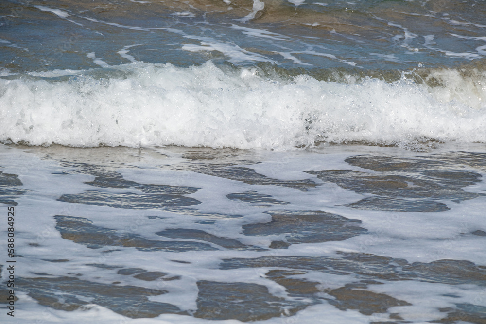 White foaming wave in the sea. Abstract water background