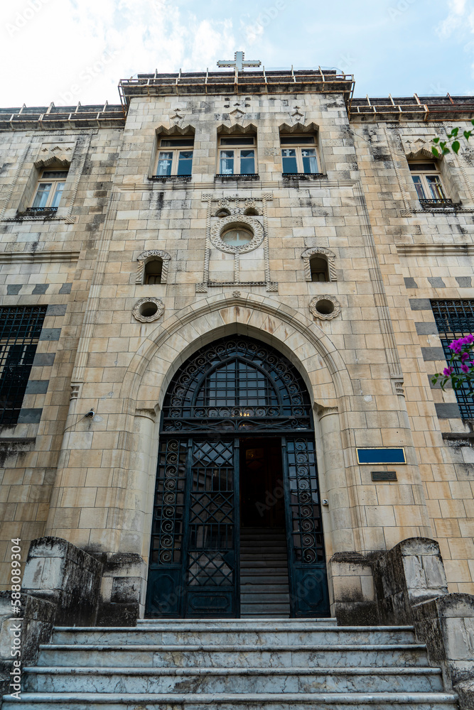 Antioch protestant church entrance door in Antakya's old town with beautiful flowers in front before 2023 Turkey–Syria earthquake.