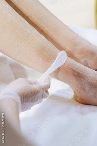 shaving leg with laser. beauty treatment