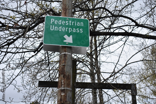 Pedestrian Underpass Green Sign with Arrow on Post in Seattle photo
