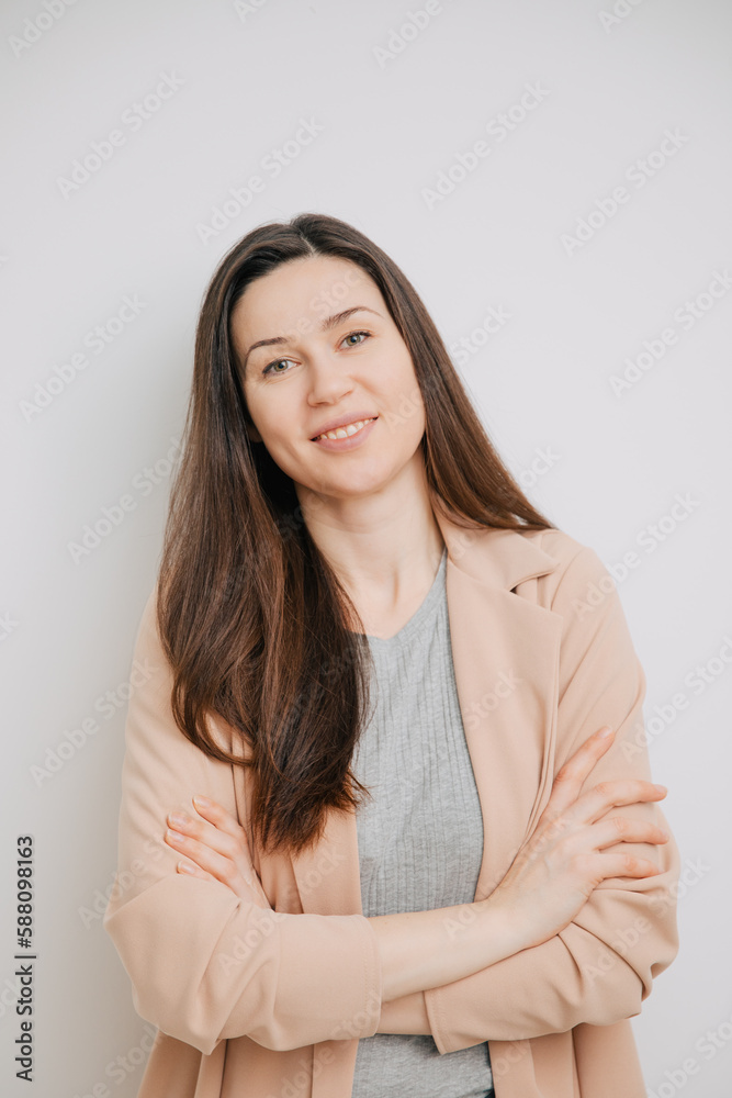 Obraz premium Imperfect young woman smiles at camera. Fresh-looking woman in a light jacket. Dating image