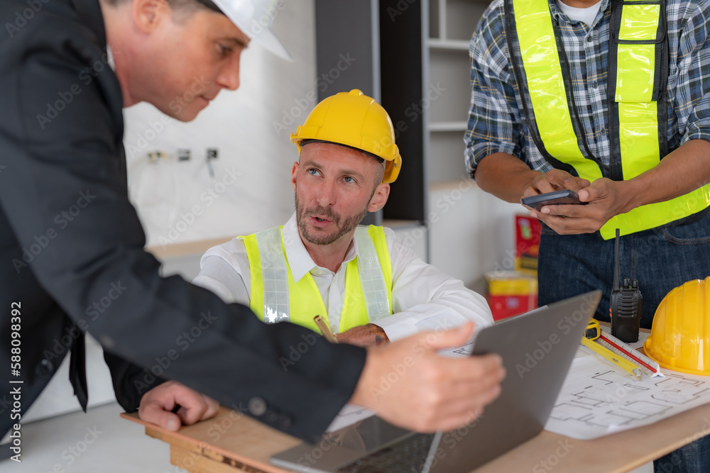 Architect and engineer work together with a sketch of the building and discussing it at the construction site. Architect and engineer work together with a sketch of the building and discussing it at the construction site.