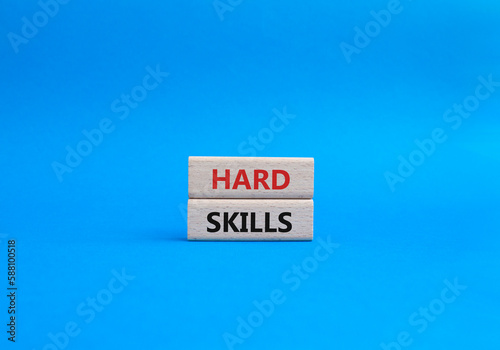 Hard skills symbol. Wooden blocks with words Hard skills. Beautiful blue background. Business and Hard skills concept. Copy space.
