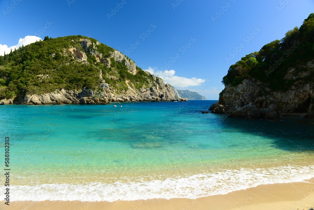 Paleonkastritsa, Corfu island, Greece. Idyllic beach among the coastal cliffs in Spring. Paleonkastritsa, Corfu island, Greece. Idyllic beach among the coastal cliffs in Spring.
