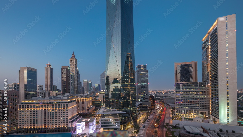 Dubai International Financial district aerial day to night timelapse. Panoramic view of business and financial office towers.