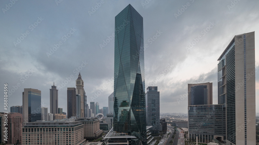 Obraz premium Dubai International Financial district aerial night to day timelapse. Panoramic view of business office towers.