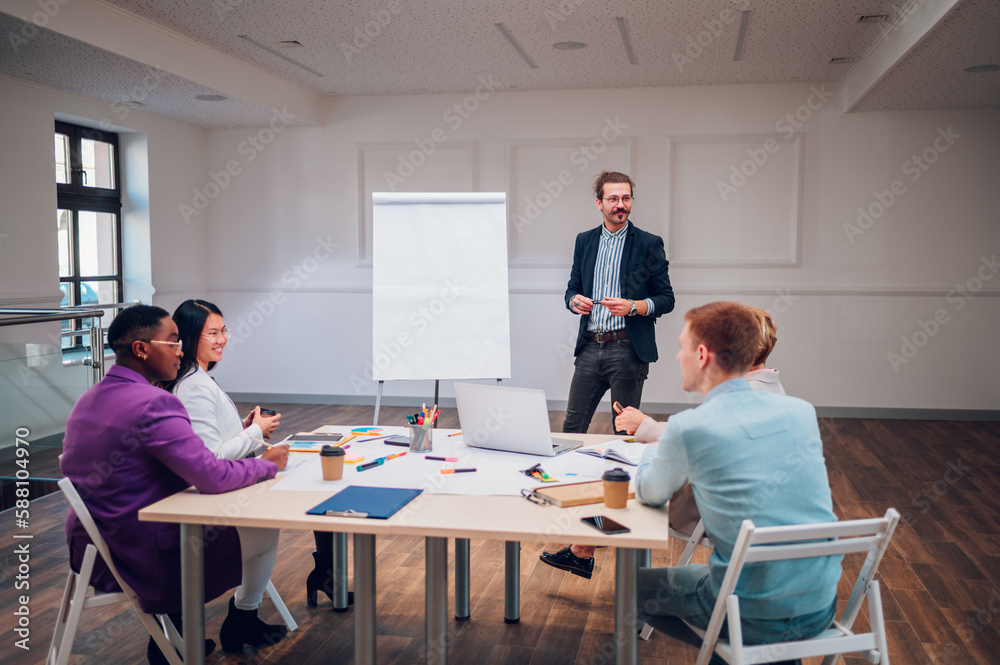 Businessman holding a presentation during a meeting in an office Businessman holding a presentation during a meeting in an office