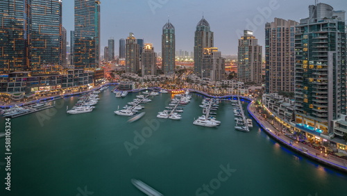 Luxury yacht bay in the city aerial day to night timelapse in Dubai marina