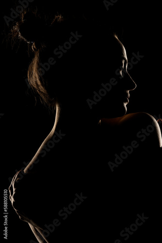 Quadro em tela Sensual portrait silhouette of beautiful woman in backlight on a black backgroun