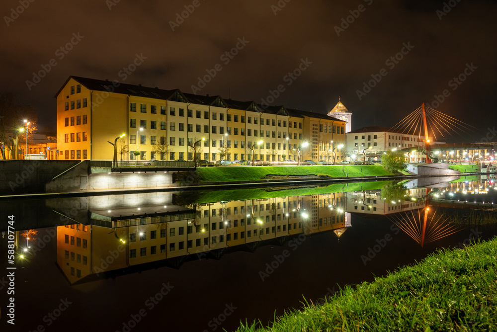 Fototapeta premium Large building near the river in the night