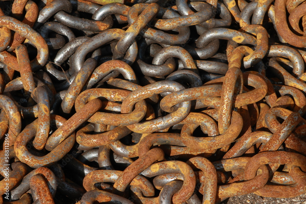 Heavy steel chain with rust on some of the links Heavy steel chain with rust on some of the links