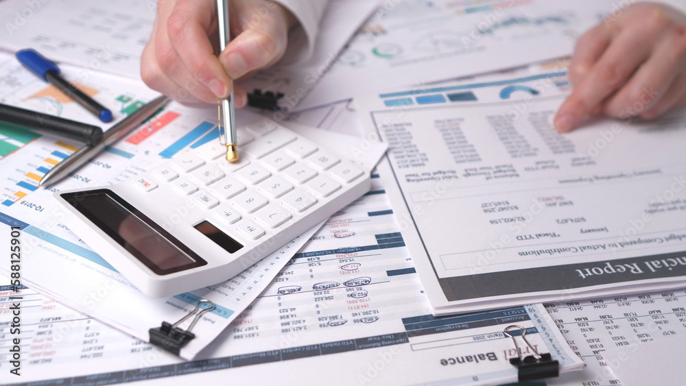 Manager checking the annual financial report Manager checking the annual financial report