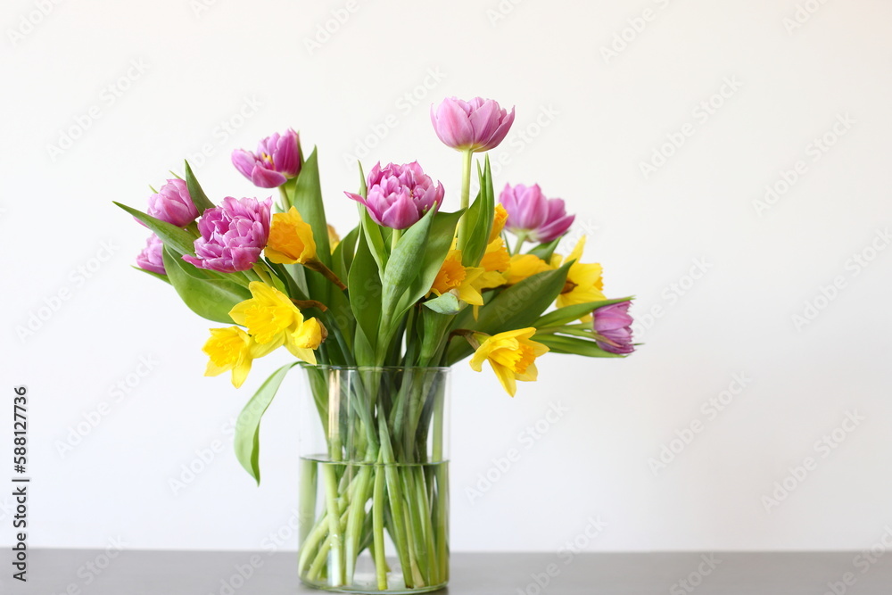 Tulips and narcissus in vase, home decor Tulips and narcissus in vase, home decor