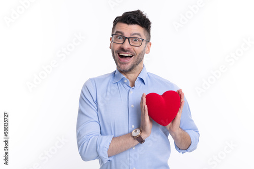 surprised man with love valentine heart isolated on white. man with love valentine heart in studio. © be free